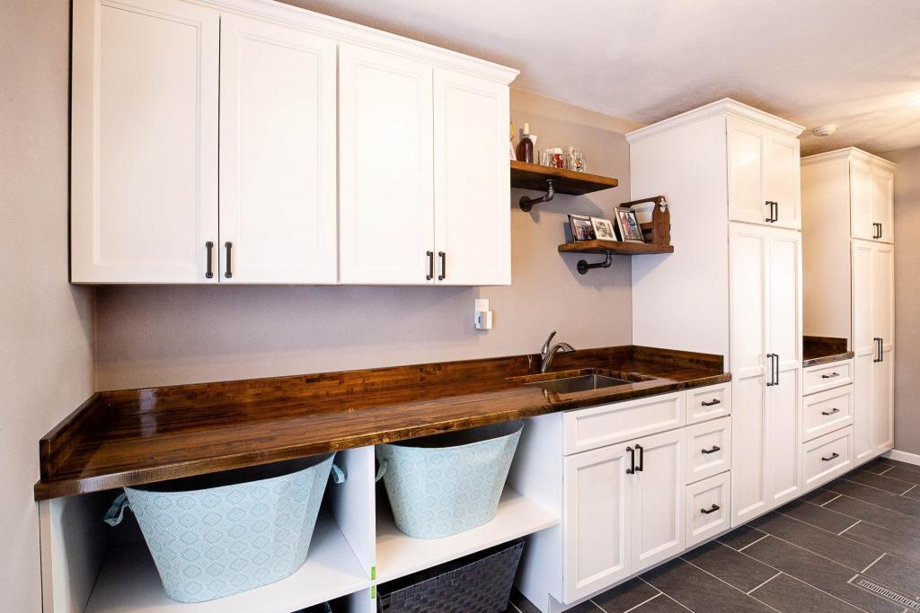 laundry room with white cabinets