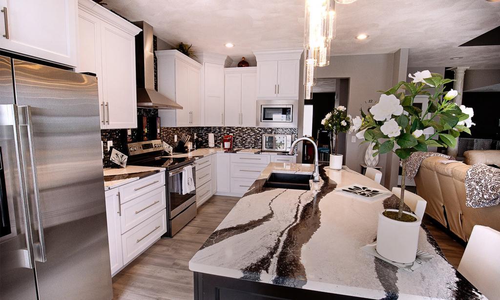 kitchen with white cabinets and black and white granite