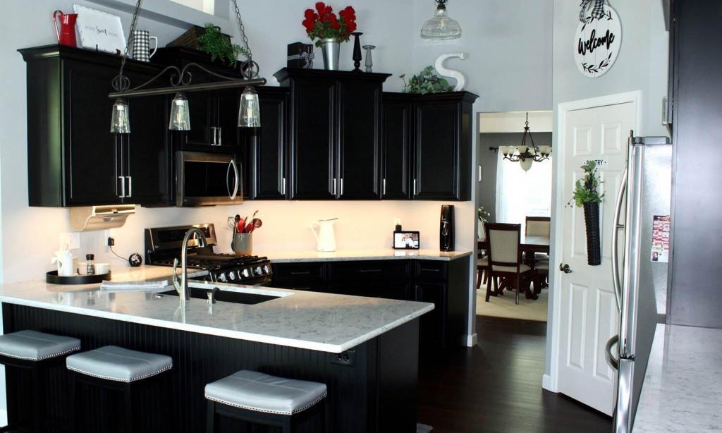 black kitchen cabinets with white counters