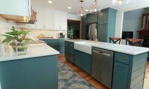 New kitchen with green cabinets and white counters