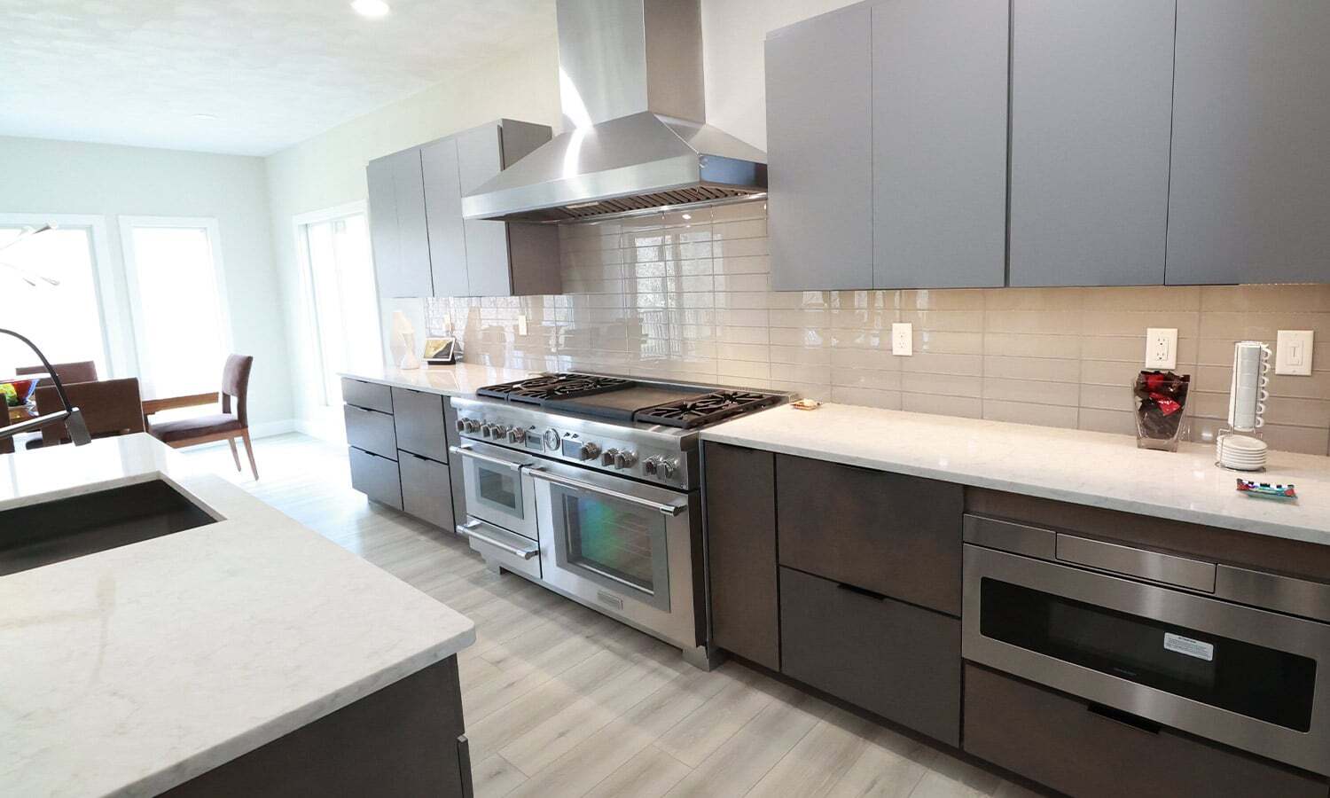 white kitchen with modern gray cabinets