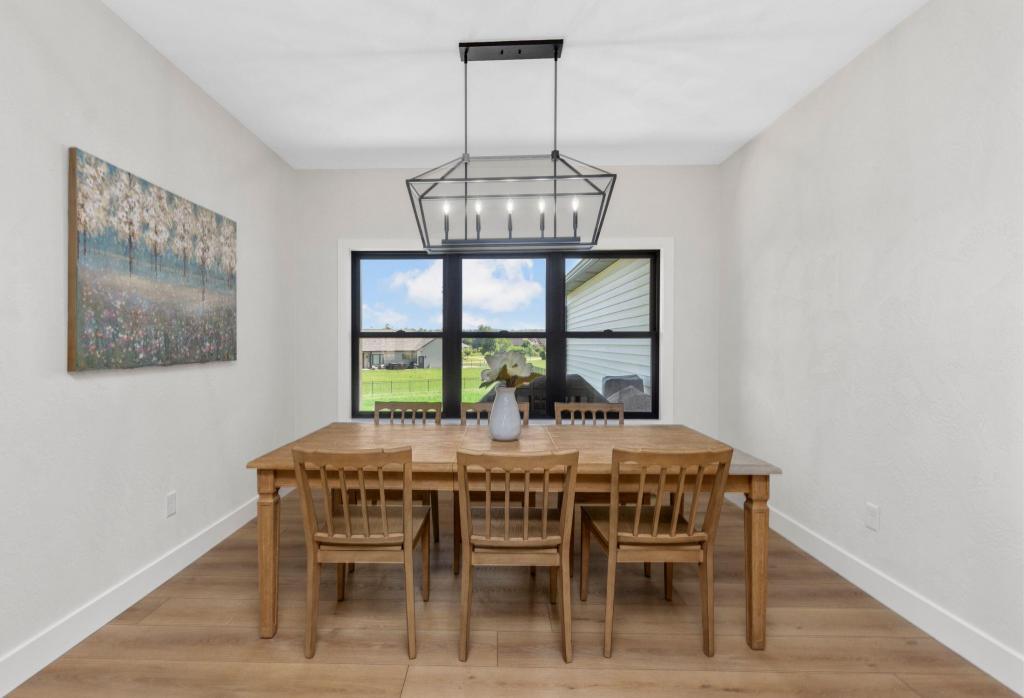 Traditional white kitchen with black framed windows in Columbia, IL.