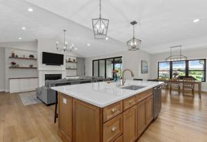 Traditional white kitchen with black framed windows in Columbia, IL.