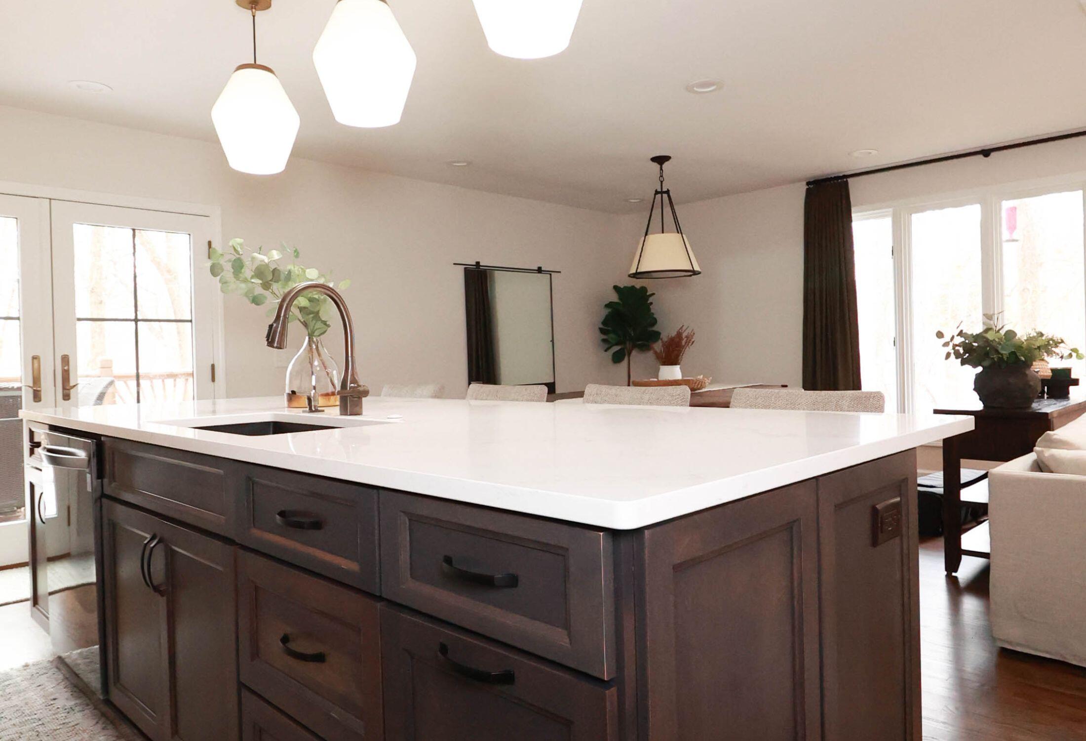 Beautiful kitchen in Waterloo, IL. Featuring dark wood cabinets and quartz counters.