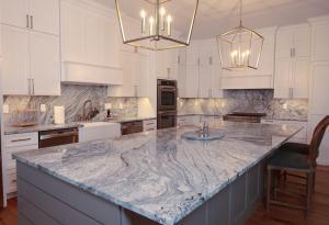 Beautiful kitchen remodel in Columbia, IL. High quality quarts and white custom Koch Cabinets.