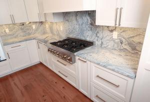 Beautiful kitchen remodel in Columbia, IL. High quality quarts and white custom Koch Cabinets.