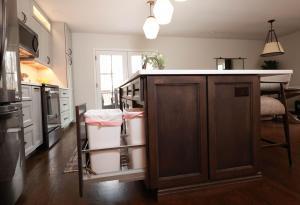 Beautiful kitchen in Waterloo, IL. Featuring dark wood cabinets and quartz counters.
