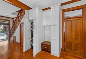 A stunning kitchen remodel in teh metro-St. Louis area that features a hidden laundry area accessible through the kitchen.