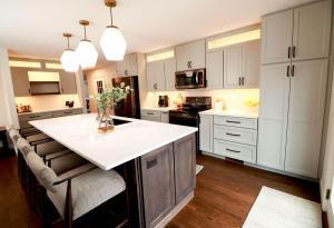 Beautiful kitchen in Waterloo, IL. Featuring dark wood cabinets and quartz counters.