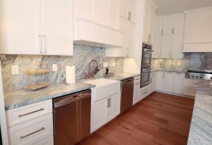 Beautiful kitchen remodel in Columbia, IL. High quality quarts and white custom Koch Cabinets.