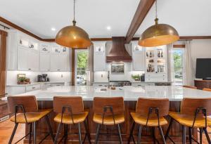 A complete kitchen remodel with domed, copper detailed lighting.&nbsp;