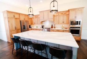 Beautiful kitchen remodel in Waterloo, IL. High quality white&nbsp; quarts counters and oak perimeter custom Koch Cabinets.