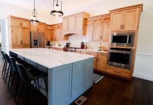 Beautiful kitchen remodel in Waterloo, IL. High quality white&nbsp; quarts counters and blue custom Koch Cabinets.
