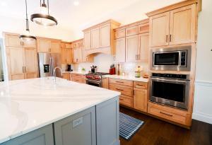 Beautiful kitchen remodel in Waterloo, IL. High quality white&nbsp; quarts counters and oak perimeter custom Koch Cabinets.